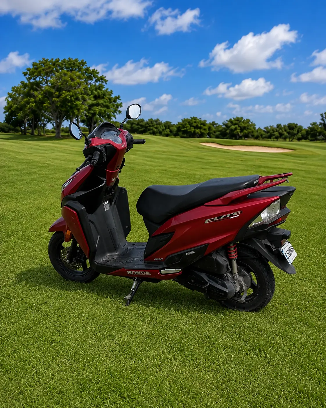 Honda Elite 125 — side, dark red scooter with fairings