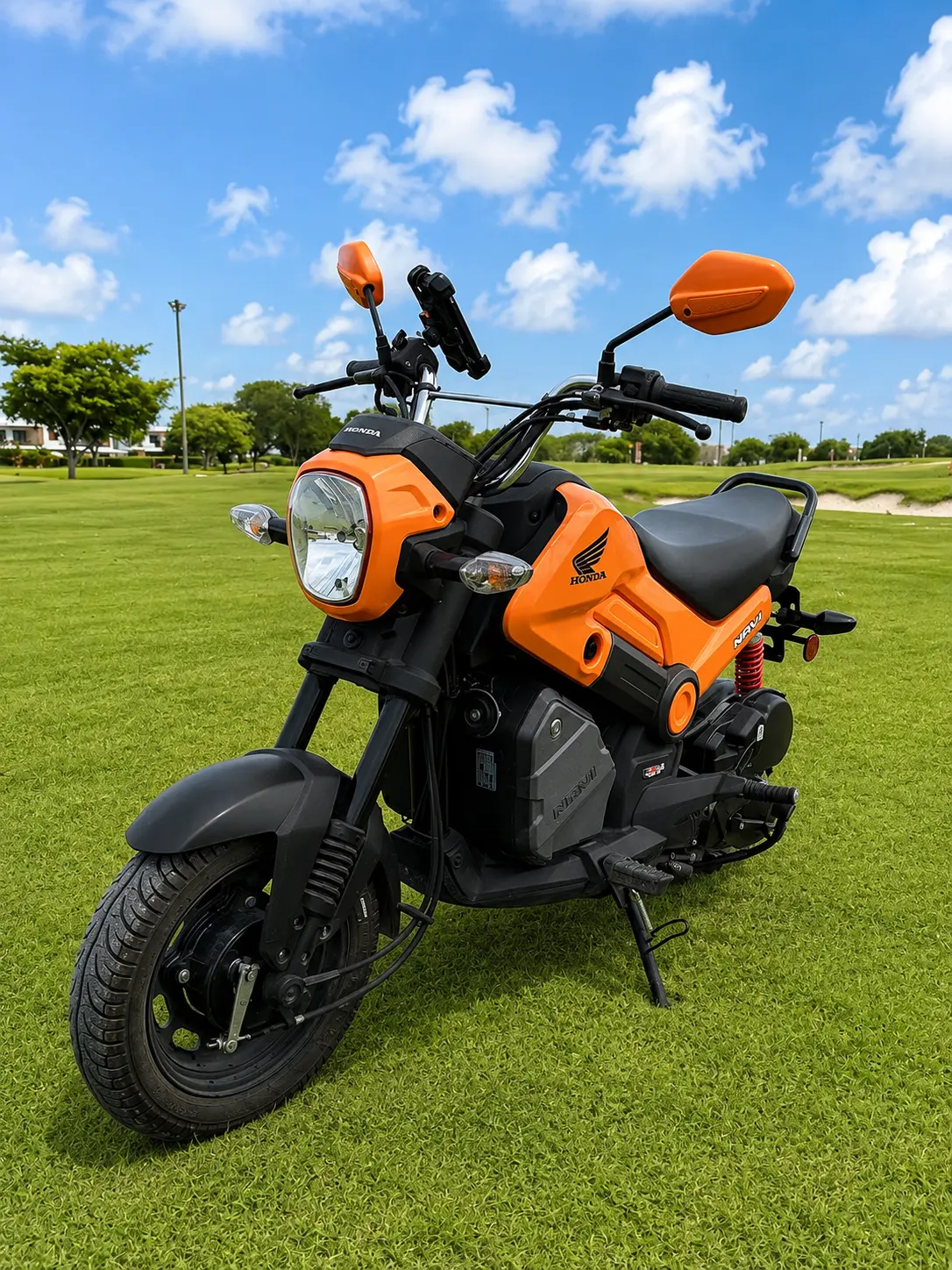 Honda Navi 110 — front, orange with phone mount