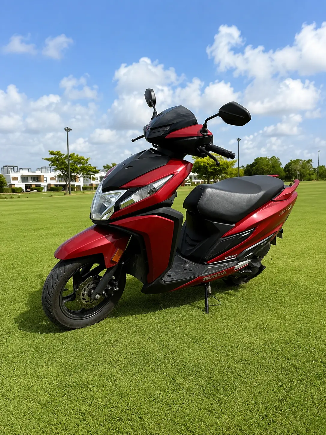 Honda Elite 125 — front three-quarter, dark red